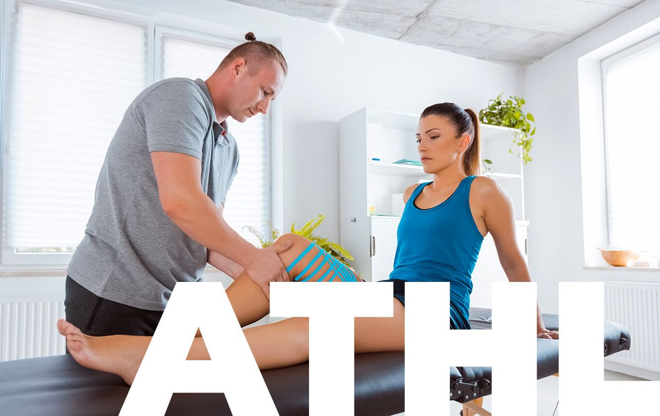 Personal trainer working on client's leg - Athletic Therapy