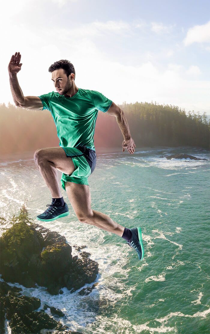 Upstream Athletics hero image athlete graphic in green and blue with background of Vancouver Island shoreline